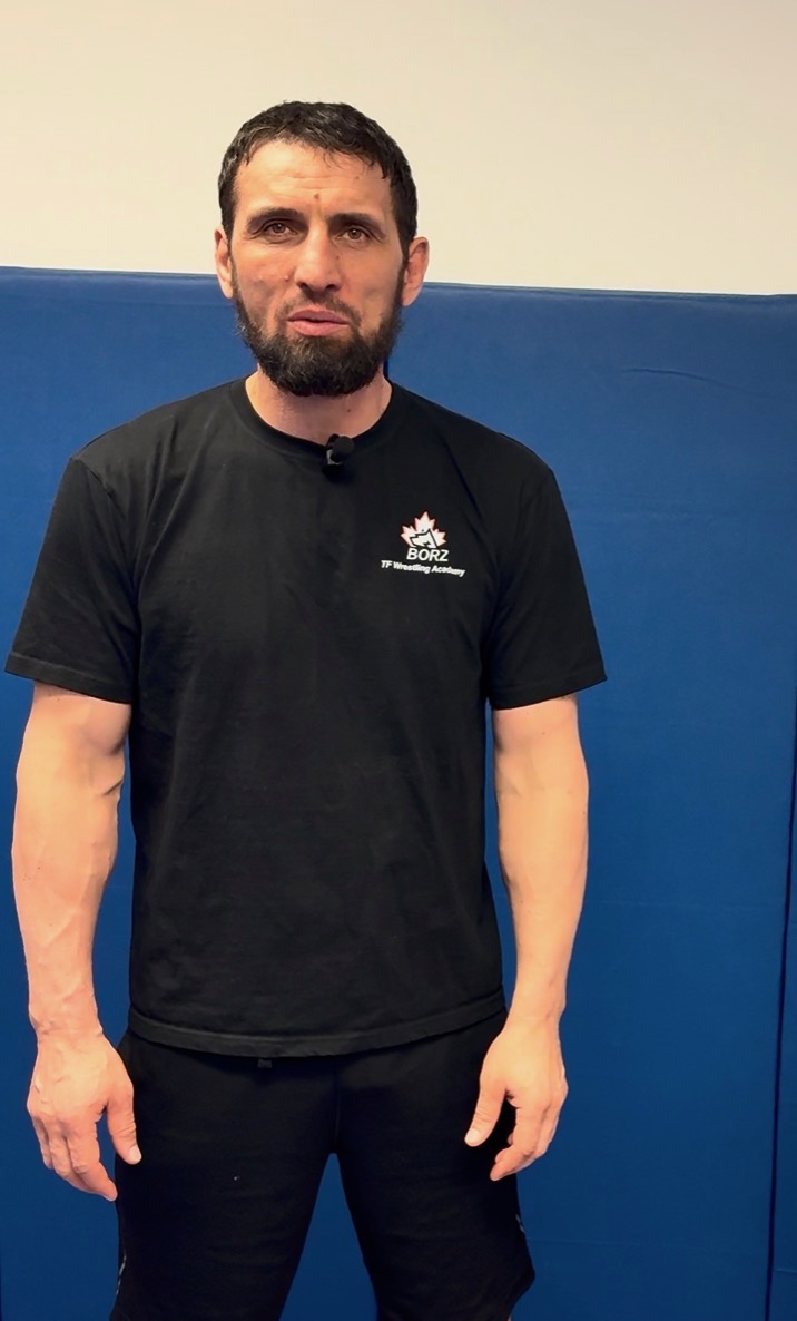 Head coach Magomed Dudadaev on the mat at Borz